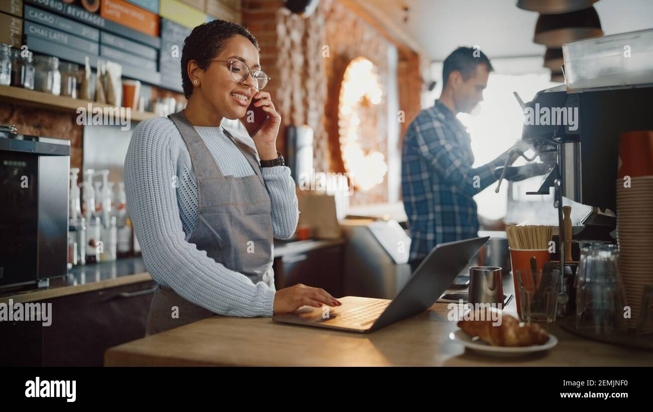 Latin American Coffee Shop Employee Accepts a PreOrder on a Mobile