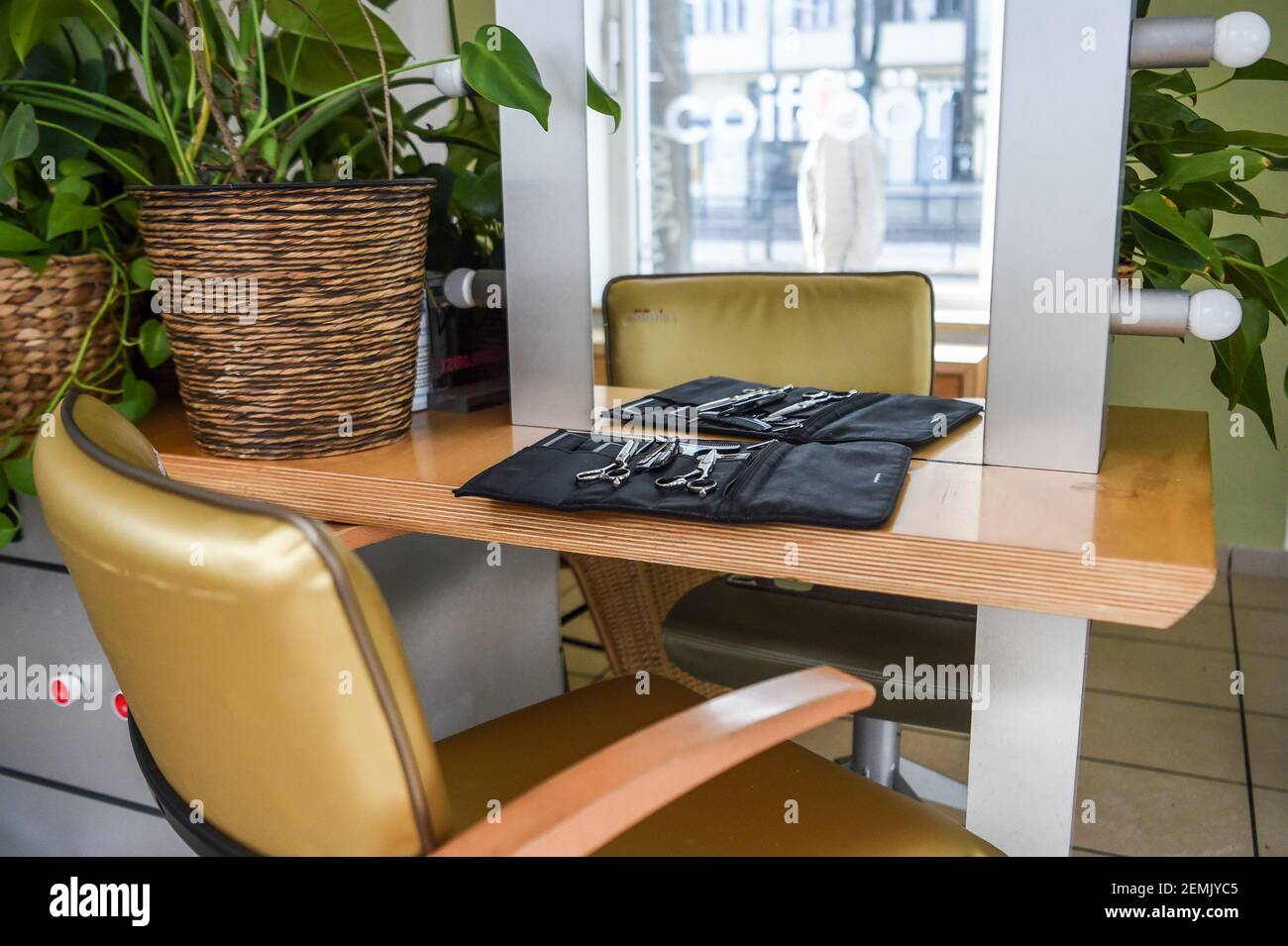 Berlin, Germany. 25th Feb, 2021. Hair scissors and combs lie on a bag