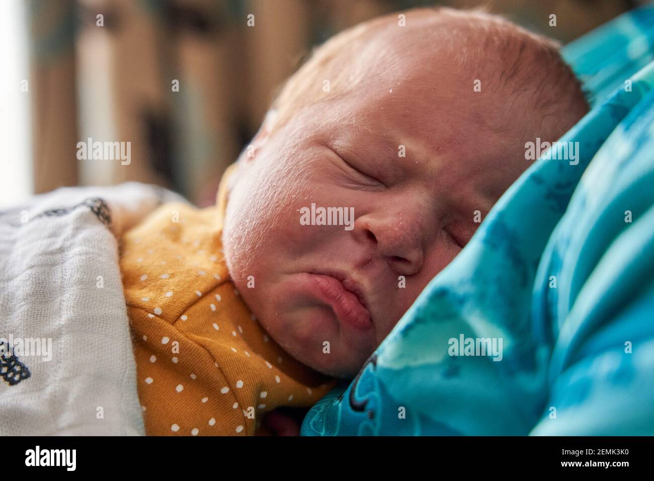 The facial expressions of a new born baby girl Stock Photo