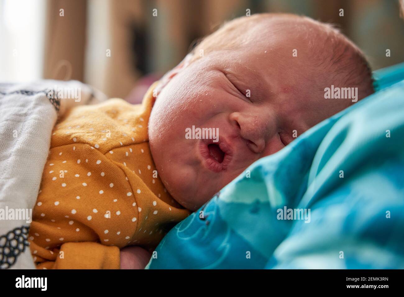 The facial expressions of a new born baby girl Stock Photo