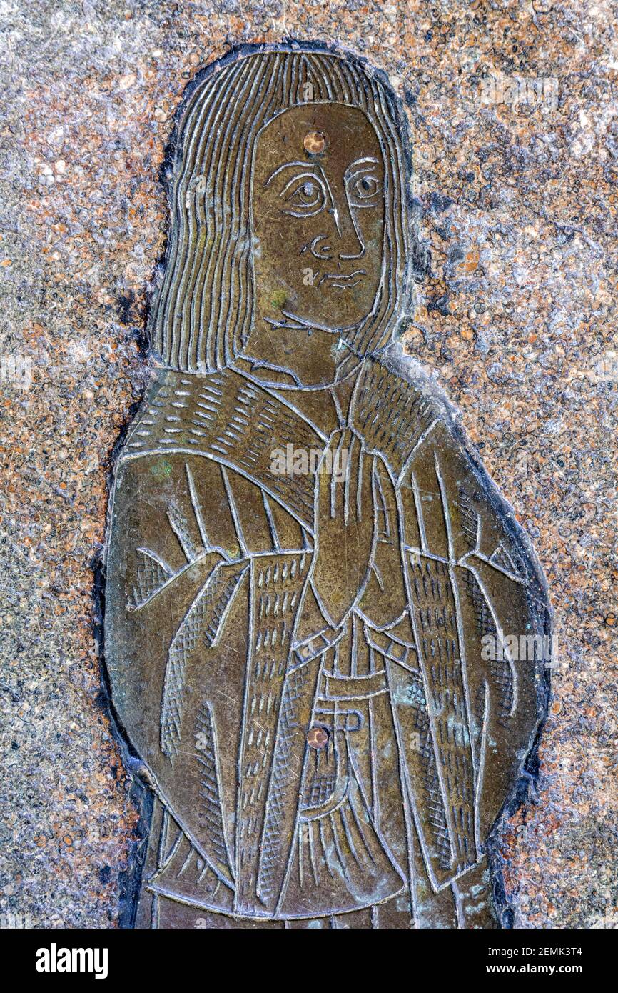 Detail of a memorial brass of a mercer Robert Serche (1501) in the church of St Peter & St Paul in the Cotswold town of Northleach, Gloucestershire UK Stock Photo