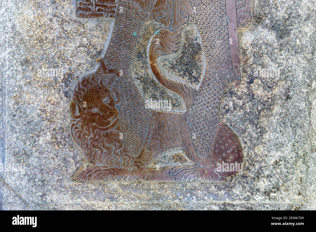 Lion at the feet of the brass of Sir Robert de Bures (died 1331) said