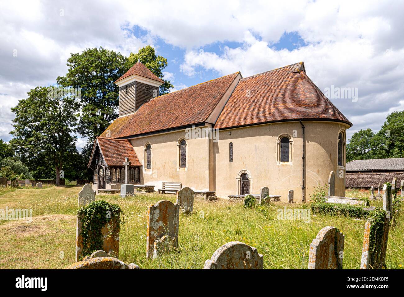 Summer in Constable Country - The Norman church of St Mary (dating back to at least 1135AD) on the banks of the River Stour at Wissington, Suffolk UK Stock Photo