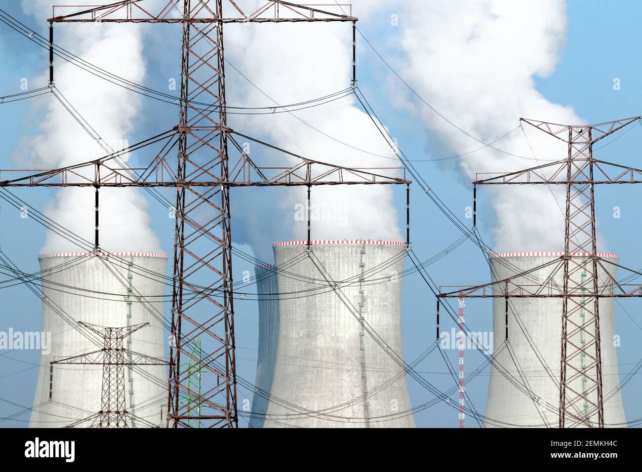 Power lines in front of cooling towers Stock Photo