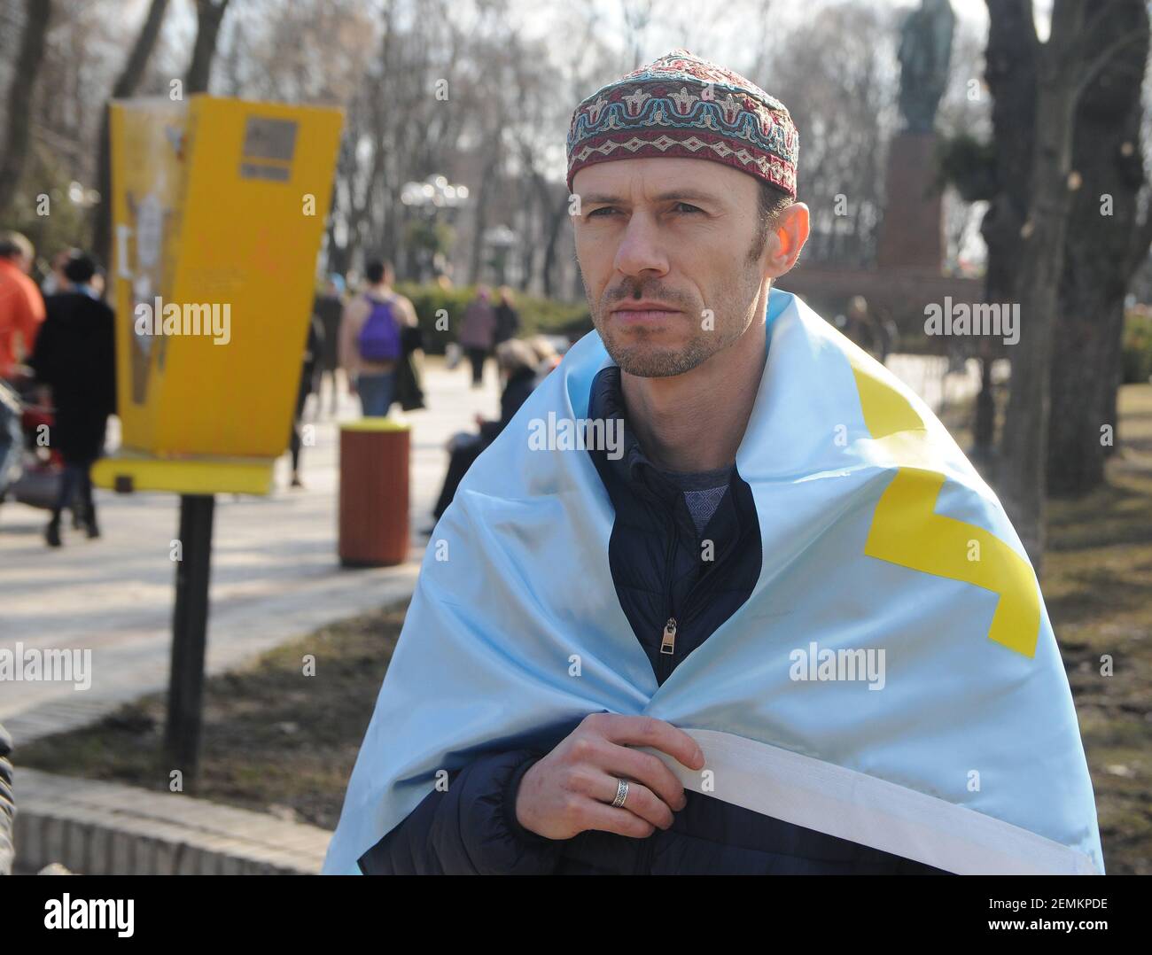 Artist, ceramist Rustem Skibin seen covered with a flag during the ...