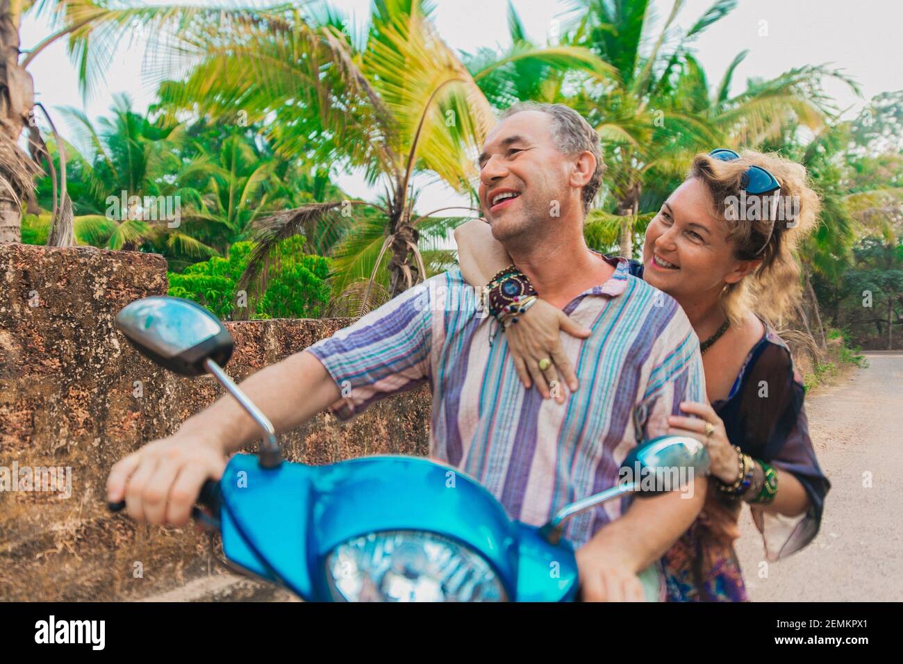 Elderly couple on scooter travel summertime dating relationship concept india Stock Photo
