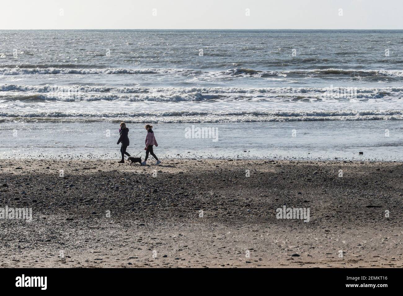 Garretstown Beach, West Cork, Ireland. 25th Feb, 2021. People were out and about at Garretstown Beach today enjoying the sunny weather during the Irish Government's COVID-19 Level 5 Lockdown. The lockdown is set to continue until 5th April. Credit: AG News/Alamy Live News Stock Photo