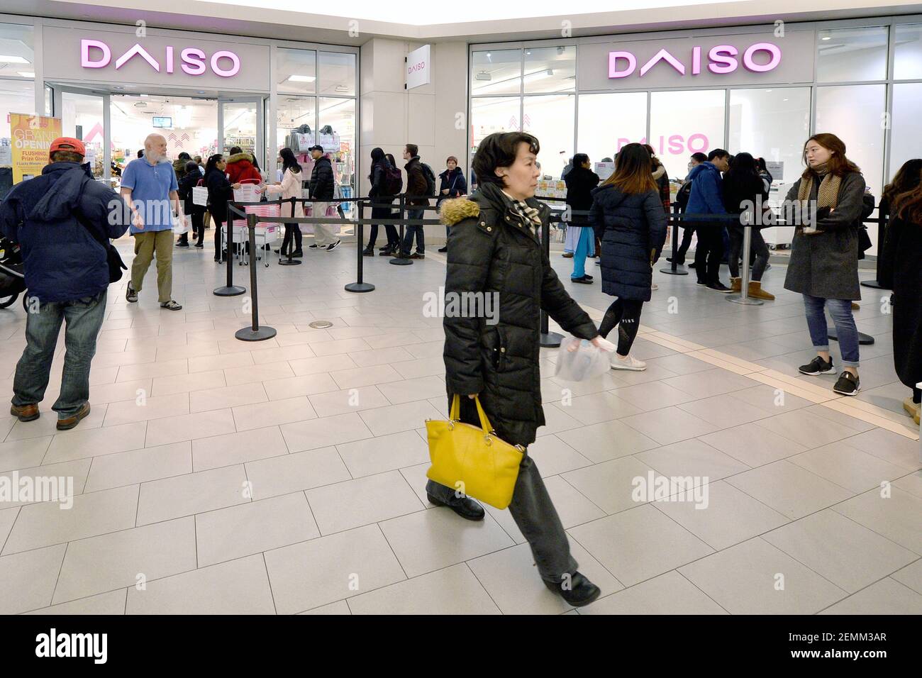 Shoppers wait in line to enter the newly opened Daiso, japanese "dollar