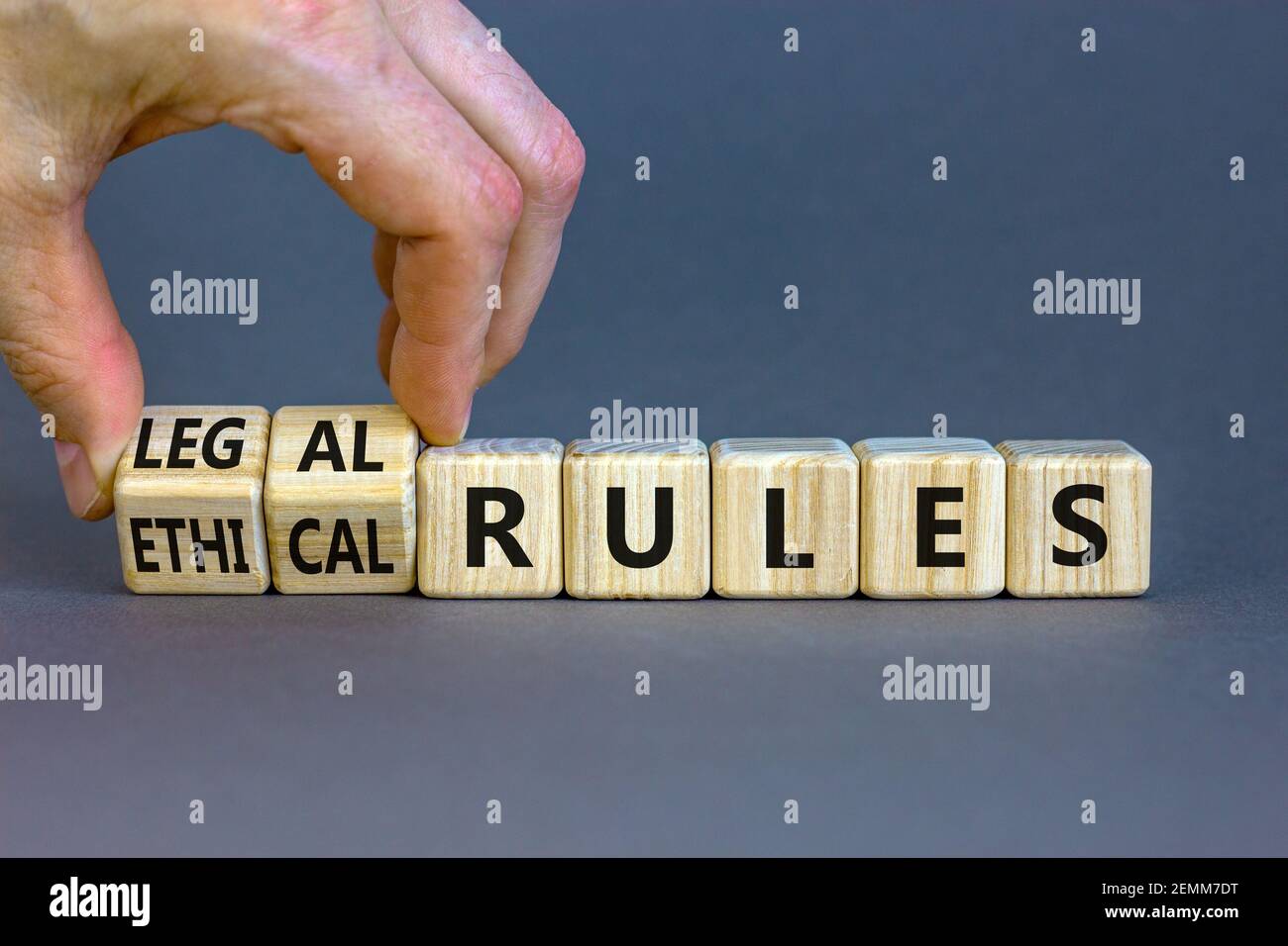 Legal Rules Image Ethical or legal rules symbol. Businessman turns wooden cubes and ...