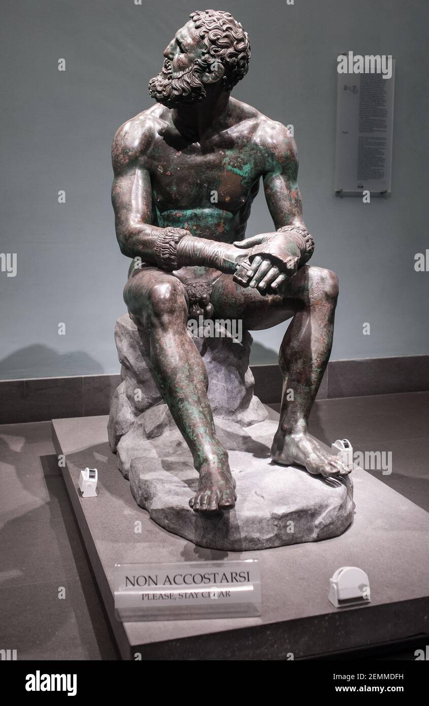 Rome, Italy C 02 05 2018: The bronze statue Boxer at Rest, Hellenistic Greek sculpture in Palazzo Massimo alle Terme Stock Photo