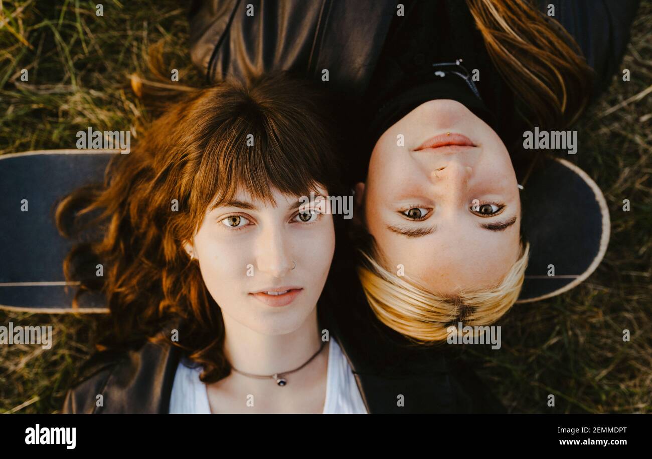 Directly above portrait of female friends lying down Stock Photo