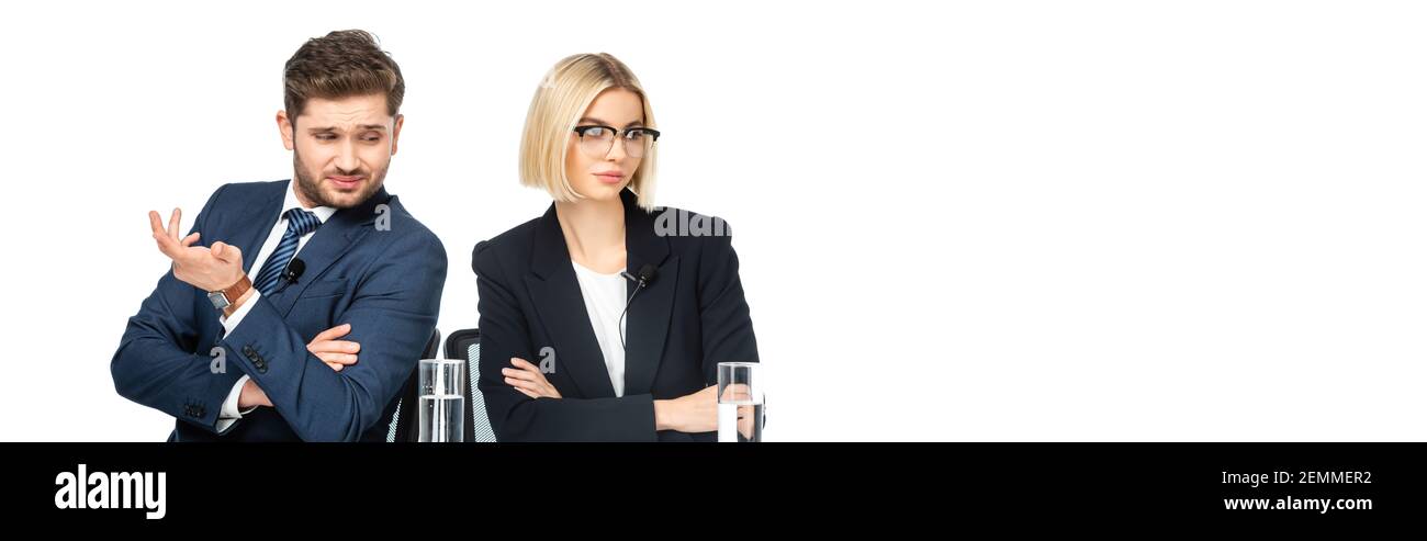 discouraged news commentator gesturing near offended colleague isolated on white, banner Stock Photo