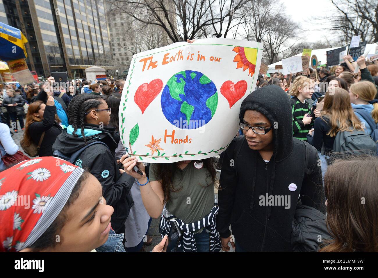 Students participate in the U.S. Youth Climate Strike at Columbus Circle in New York, NY, March 15, 2019. Thousands of students around the world skipped school Friday to protest lack of action on climate change. (Photo by Anthony Behar/Sipa USA) Stock Photo