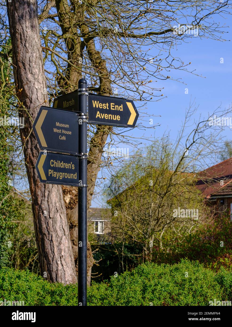 Pole with 4 signs in Pinner Memorial Park, pointing out Children’s
