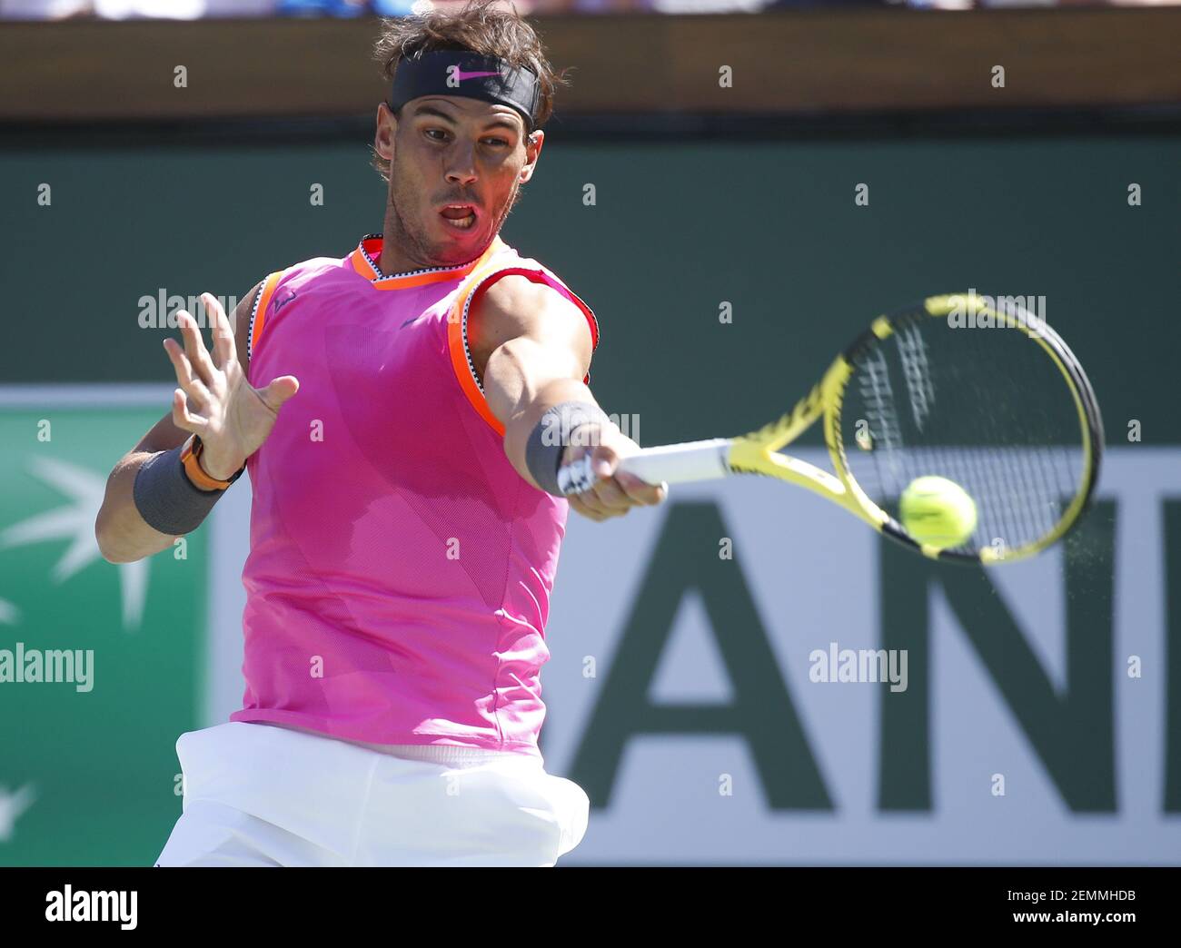 Rafael Nadal (ESP) returns a shot against Karen Khachanov (RUS) during his  quarterfinals at the 2019 BNP Paribas Open at Indian Wells Tennis Garden in Indian  Wells, California. Charles Baus/(Photo by Charles
