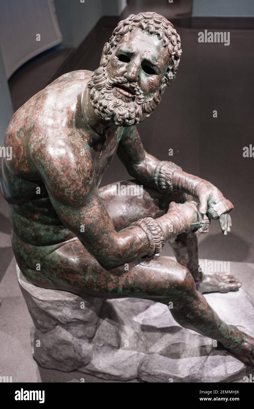 Rome, Italy C 02 05 2018: The bronze statue Boxer at Rest, Hellenistic Greek sculpture in Palazzo Massimo alle Terme Stock Photo