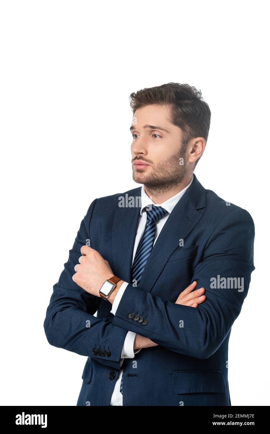pensive businessman with crossed arms looking away isolated on white ...