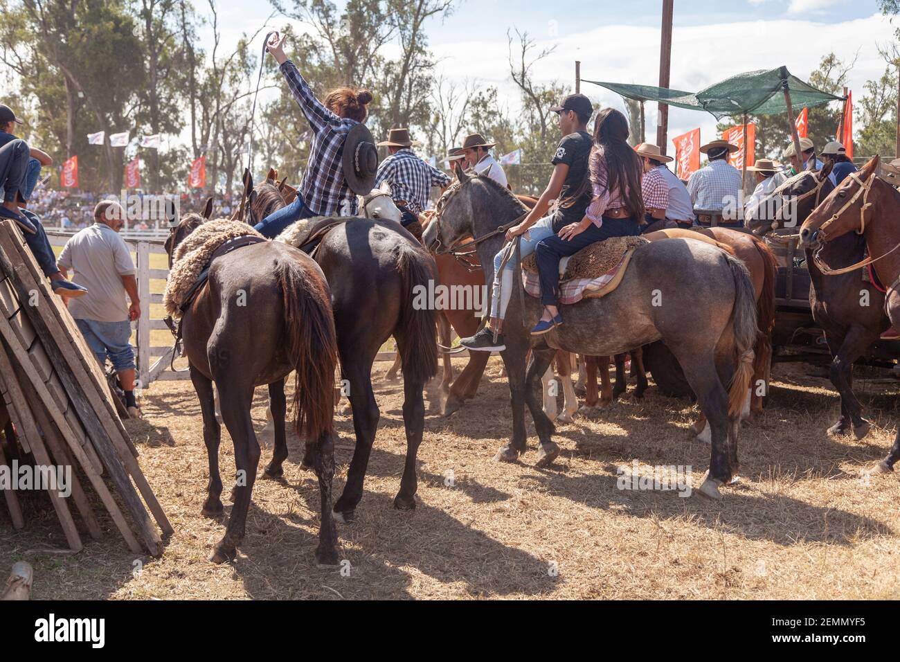 Local spectators watch the Rodeo while riding their horses during the ...