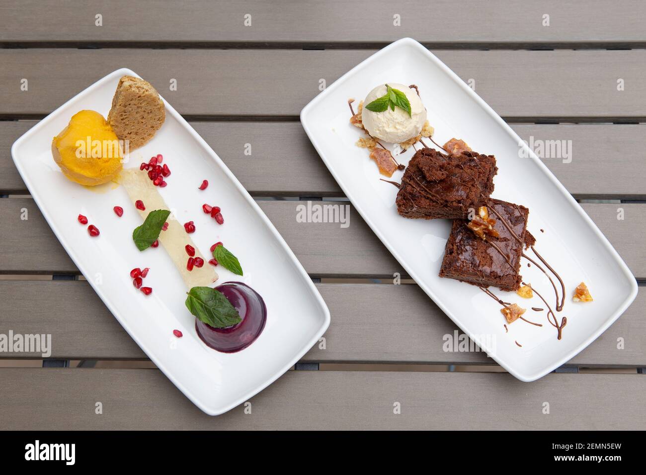 Desserts on white plates Stock Photo