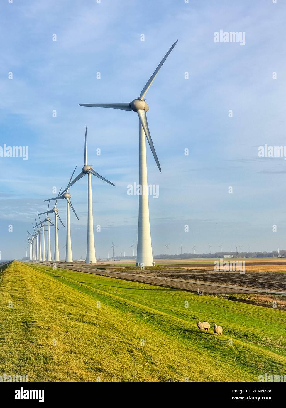 Windmill village indrustial wind mill by the lake Ijsselmeer