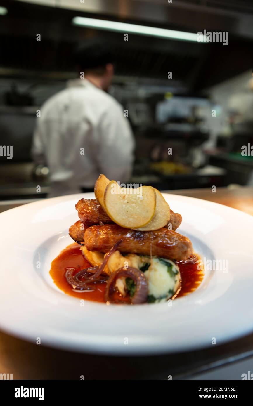 Sausage and mash served in a restaurant Stock Photo