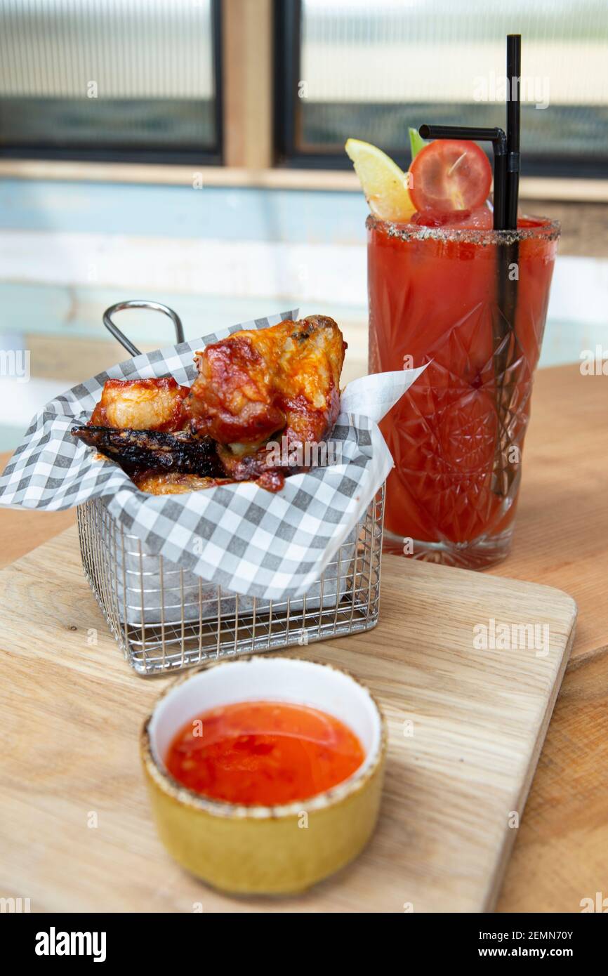 Sticky Wings served with a Bloody Mary Stock Photo