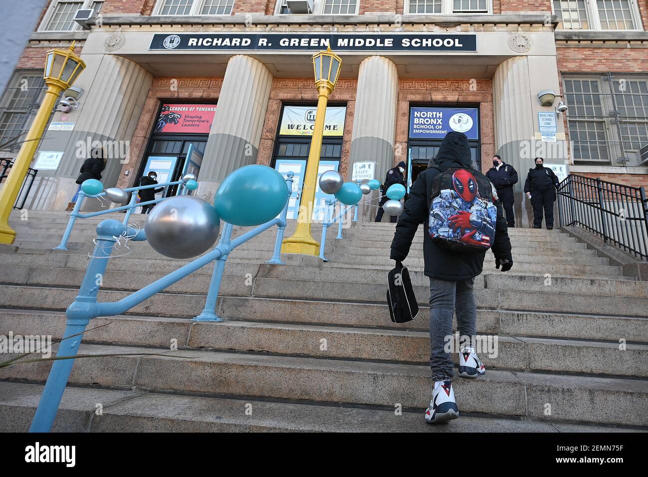 New York, USA. 25th Feb, 2021. A returning student climbs the steps at ...