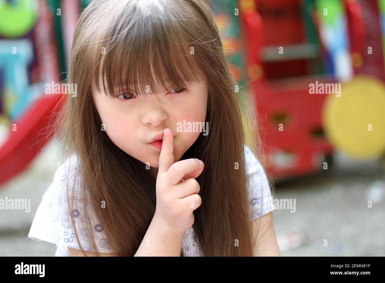 Portrait of beautiful young girl on the playground Stock Photo - Alamy