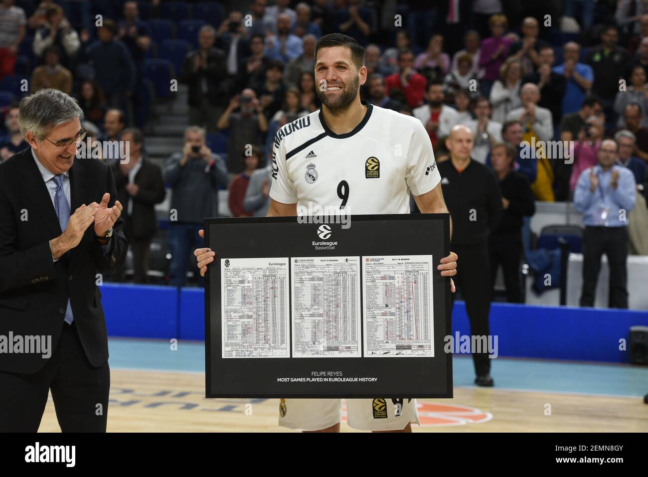 Euroleague Basketball CEO Jordi Bertomeu, center, poses with former Real Madrid basketball player Joe Arlauckas of U.S., left, and former England soccer player Graeme Le Saux during a celebratory unified basketball game as part of Euroleague ...
