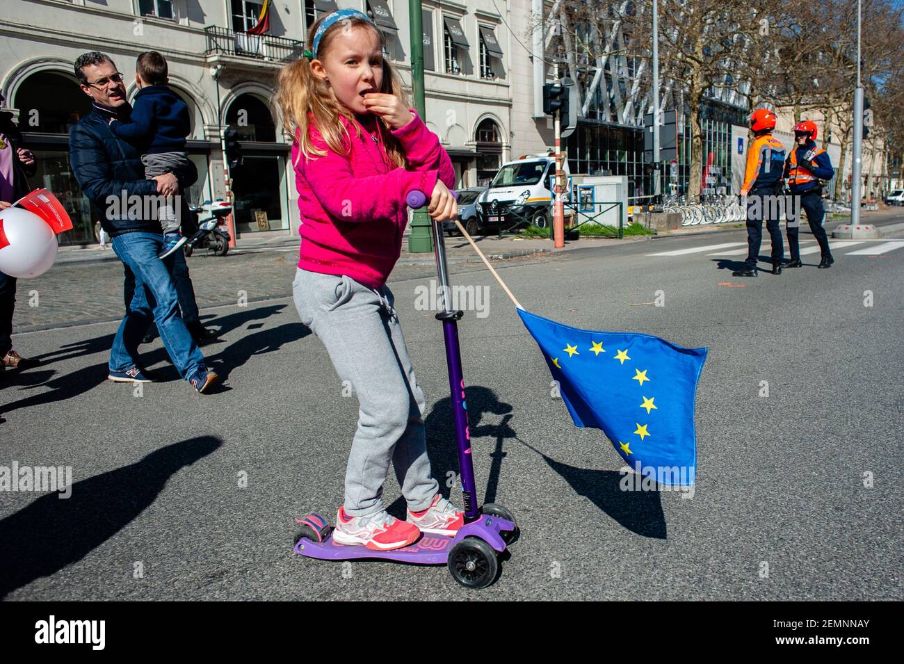 A girl is using a skateboard while is holding a EU flag during the March for Europe celebrated in Brussels, on March 24th, 2019. A day before the anniversary of the founding Treaty of the European Union, citizens and civil society organizations took the streets of Brussels to make a stand, two months before the European elections. The march was organized by Together platform, an initiative launched by an alliance of progressive political groups from across Europe. They stand for solidarity, democracy, and peace against the real threat to their core European values.(Photo by Romy Fernandez/Sipa Stock Photo