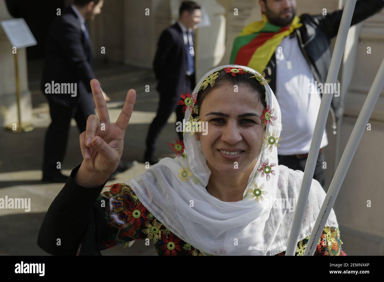 (3/23/2019) A Kurdish woman in traditional clothes makes a victory sign ...