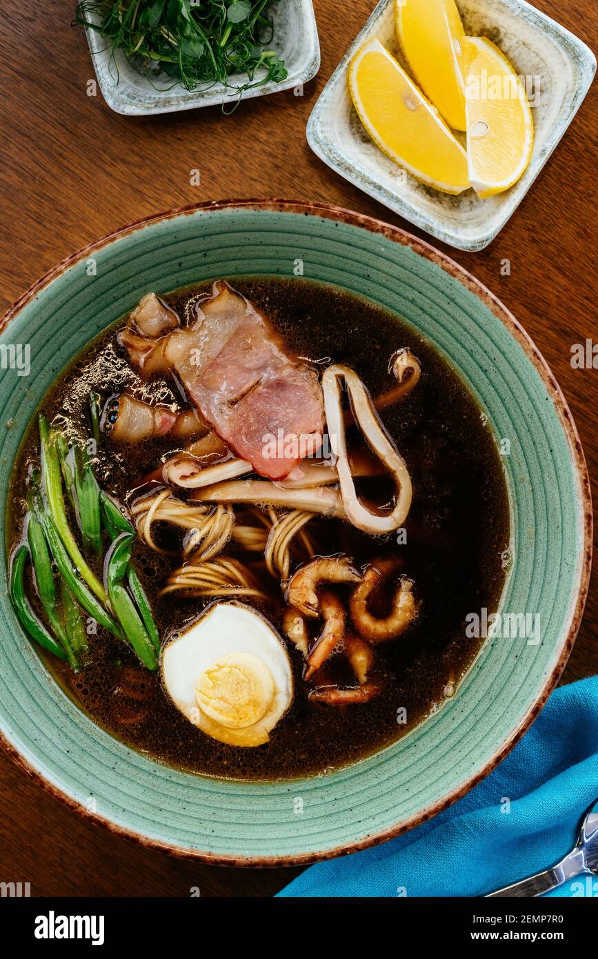 asian noodle soup with egg and seafood Stock Photo Alamy
