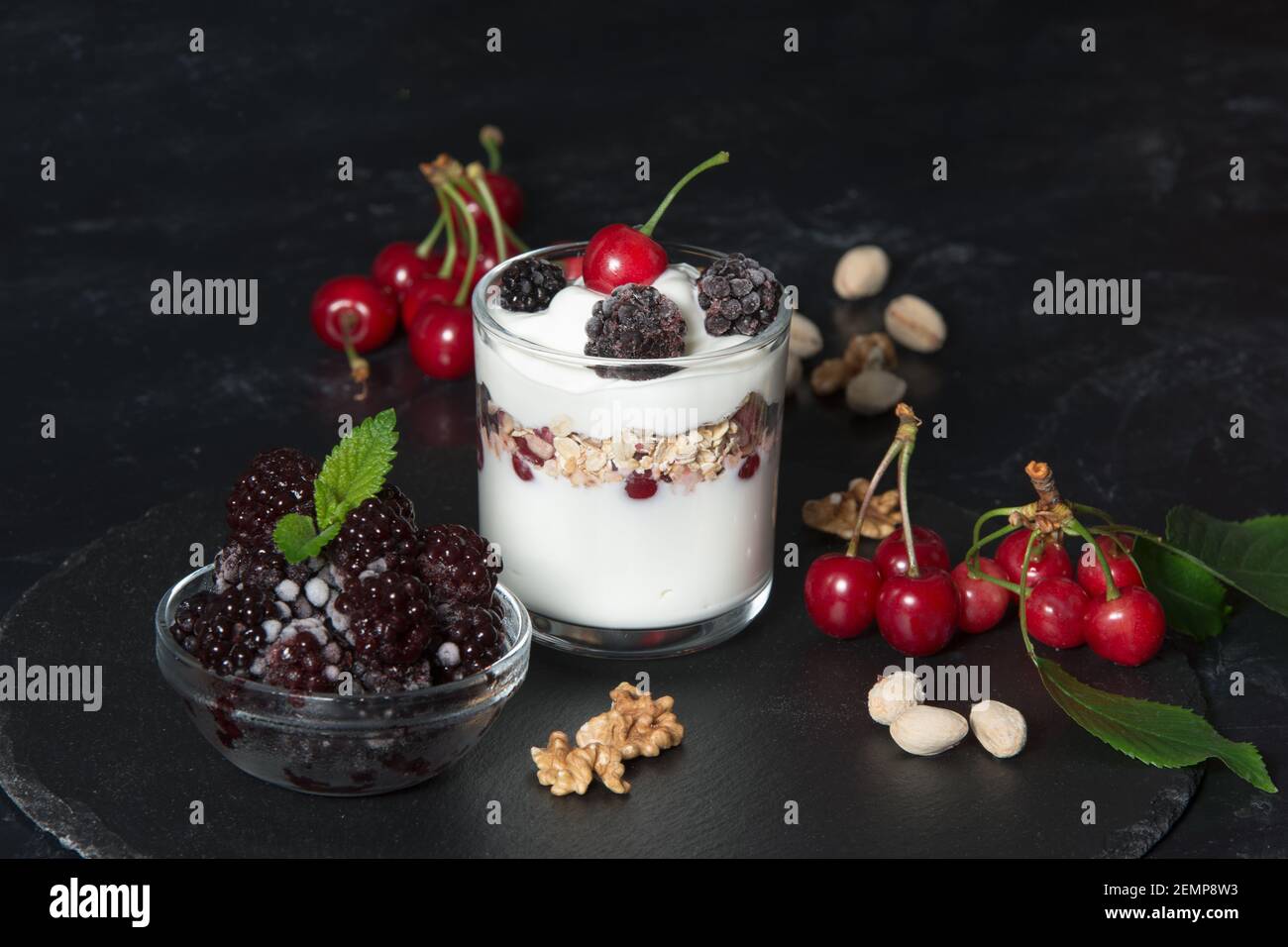 Healthy breakfast with yogurt cream, flakes, nuts and fruits Stock