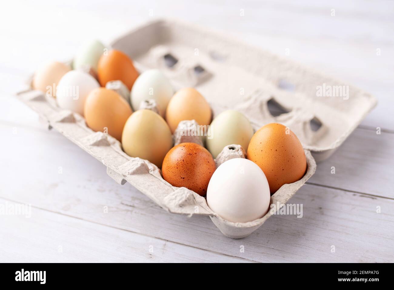 Fresh eggs from free range chickens on a small farm, beautiful colorful eggs from different breeds of chickens Stock Photo