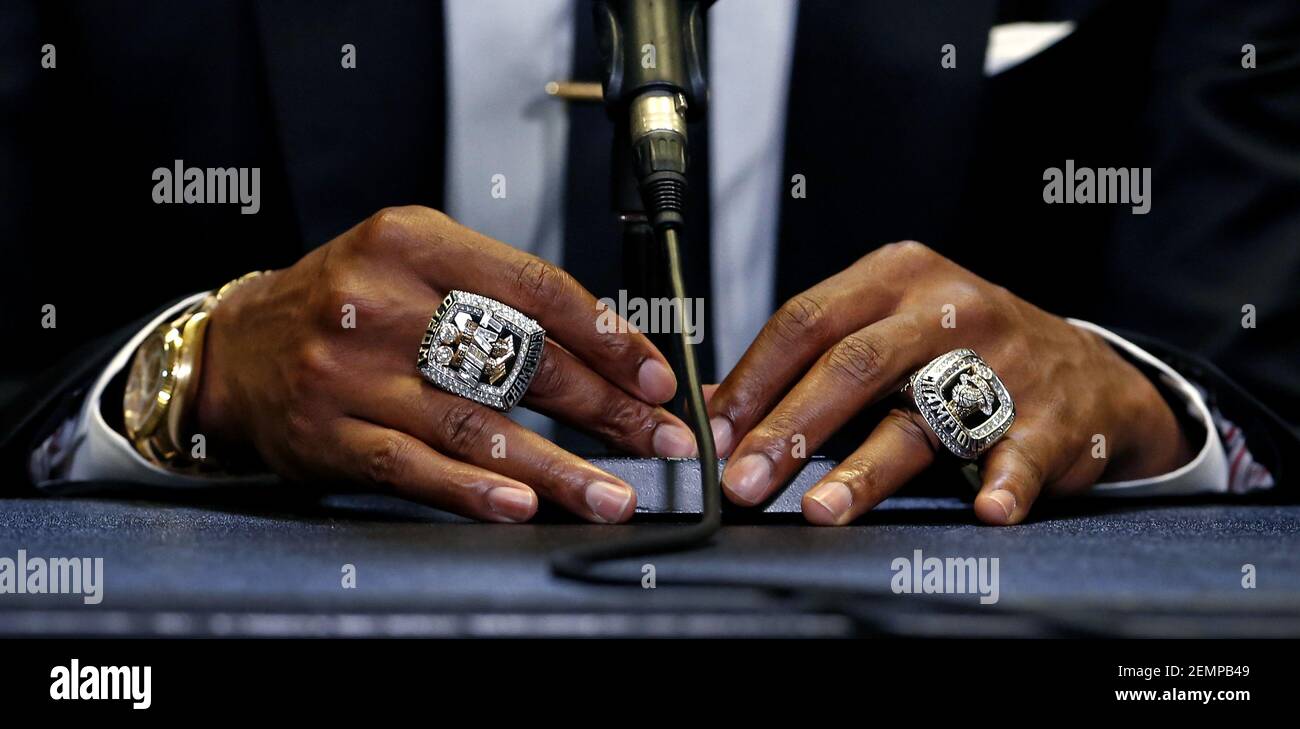 Former Miami Heat forward Chris Bosh speaks with the Media while wearing  his championship rings before his jersey retirement ceremony during  halftime of an NBA basketball game against the Orlando Magic at