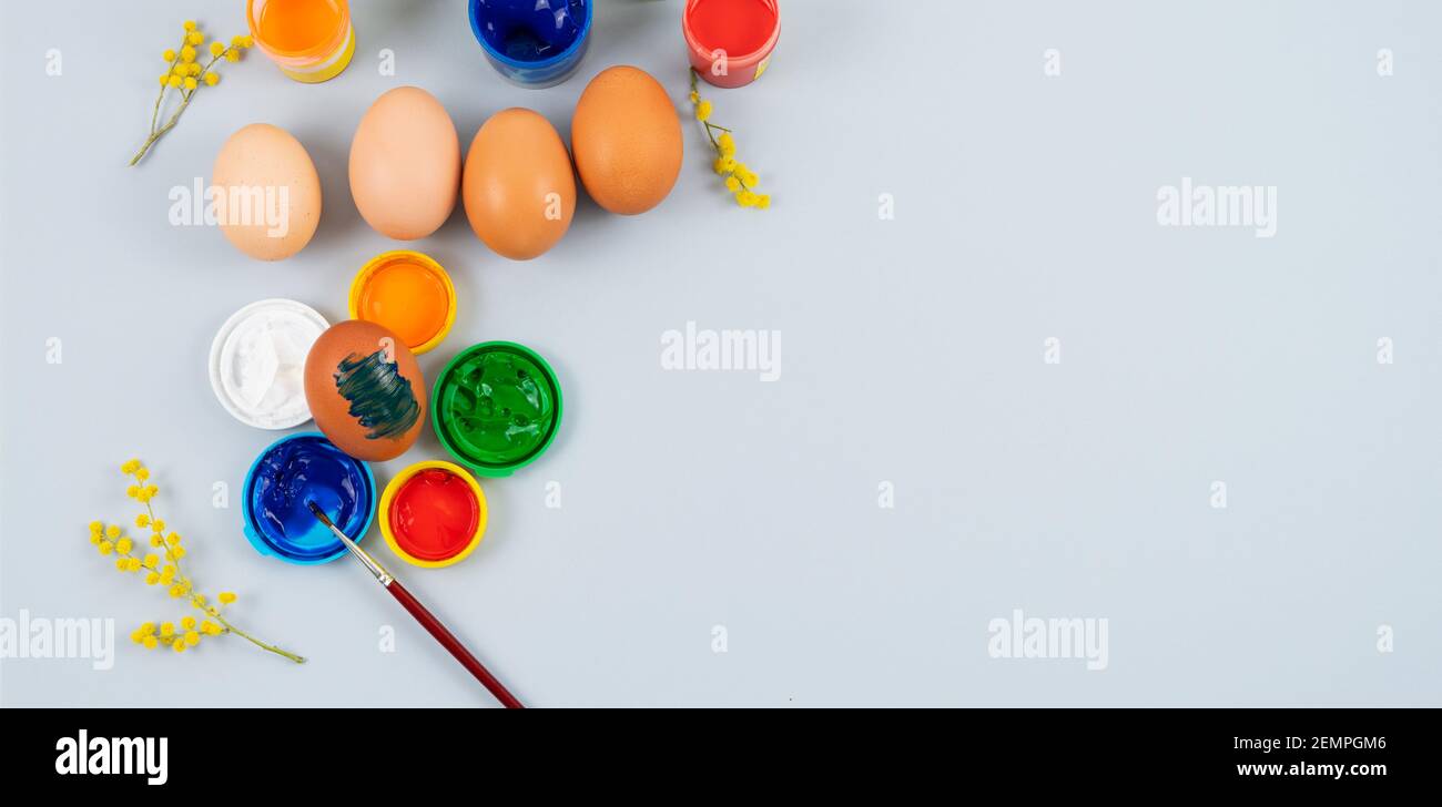 Eggs and paints. Easter eggs decoration process. Stock Photo
