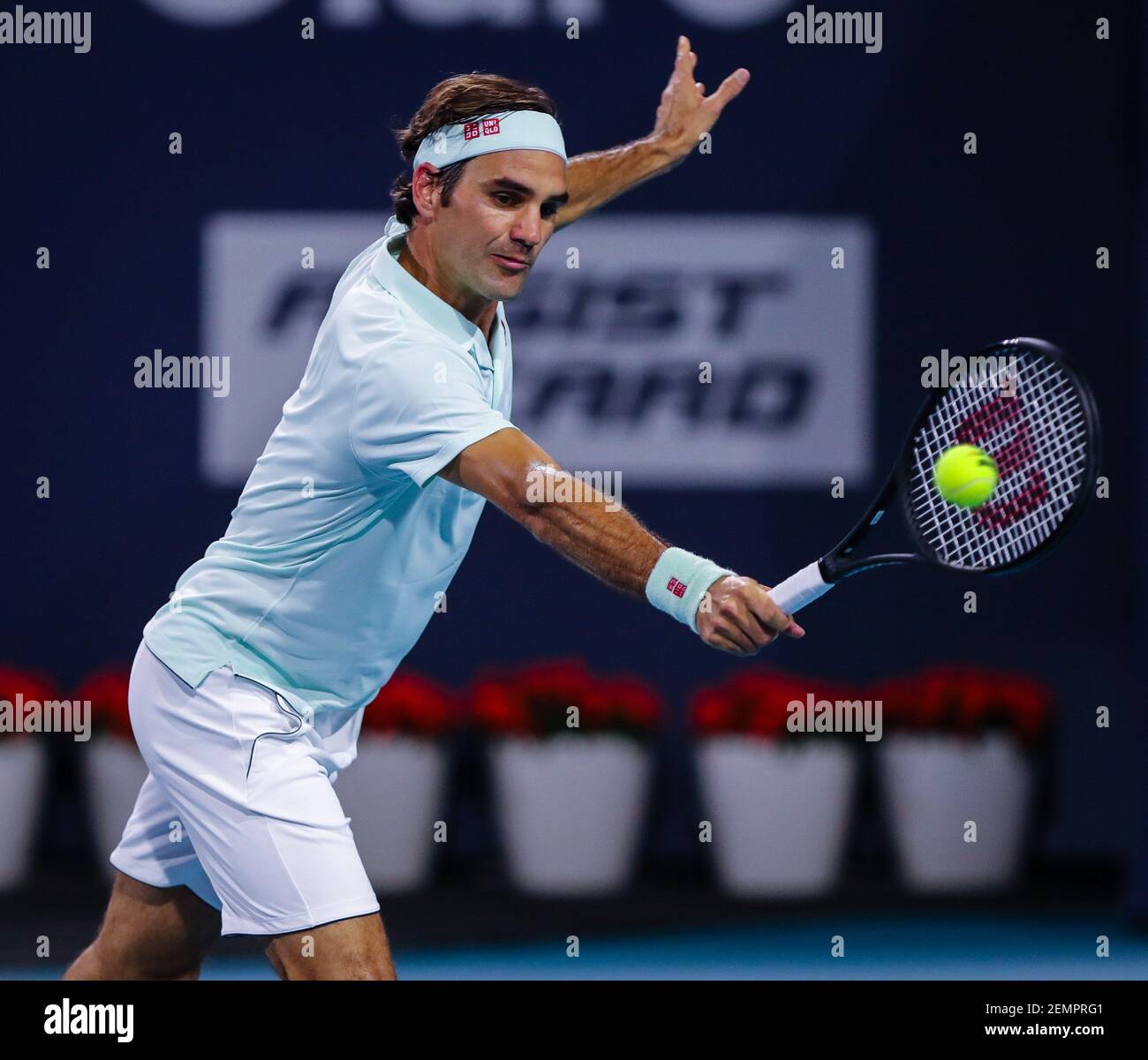 March 29, 2019: Roger Federer, of Switzerland, hits a backhand against  Denis Shapovalov, of Canada, during a semifinal match at the 2019 Miami Open  Presented by Itau professional tennis tournament, played at