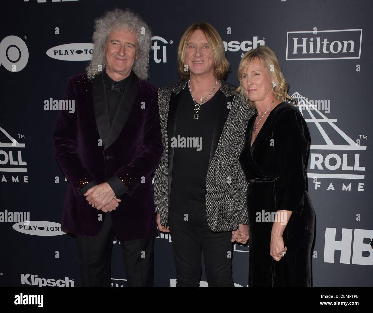 Brian May of Queen, Inductee Joe Elliott of Def Leppard, and Kristine