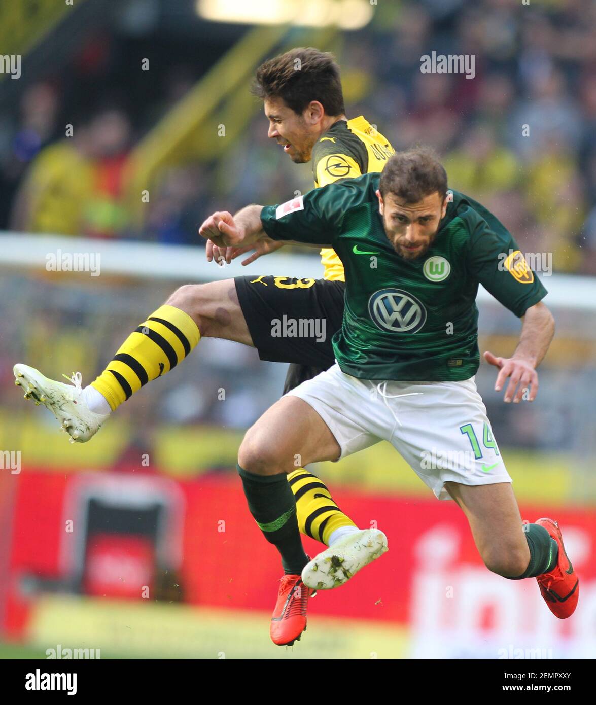 Raphael Guerreiro of Borussia Dortmund and Admir Mehmedi of Vfl Wolfsburg  are seen in action during the Bundesliga match between Borussia Dortmund  and VfL Wolfsburg at the Signal Iduna Park. ( Final