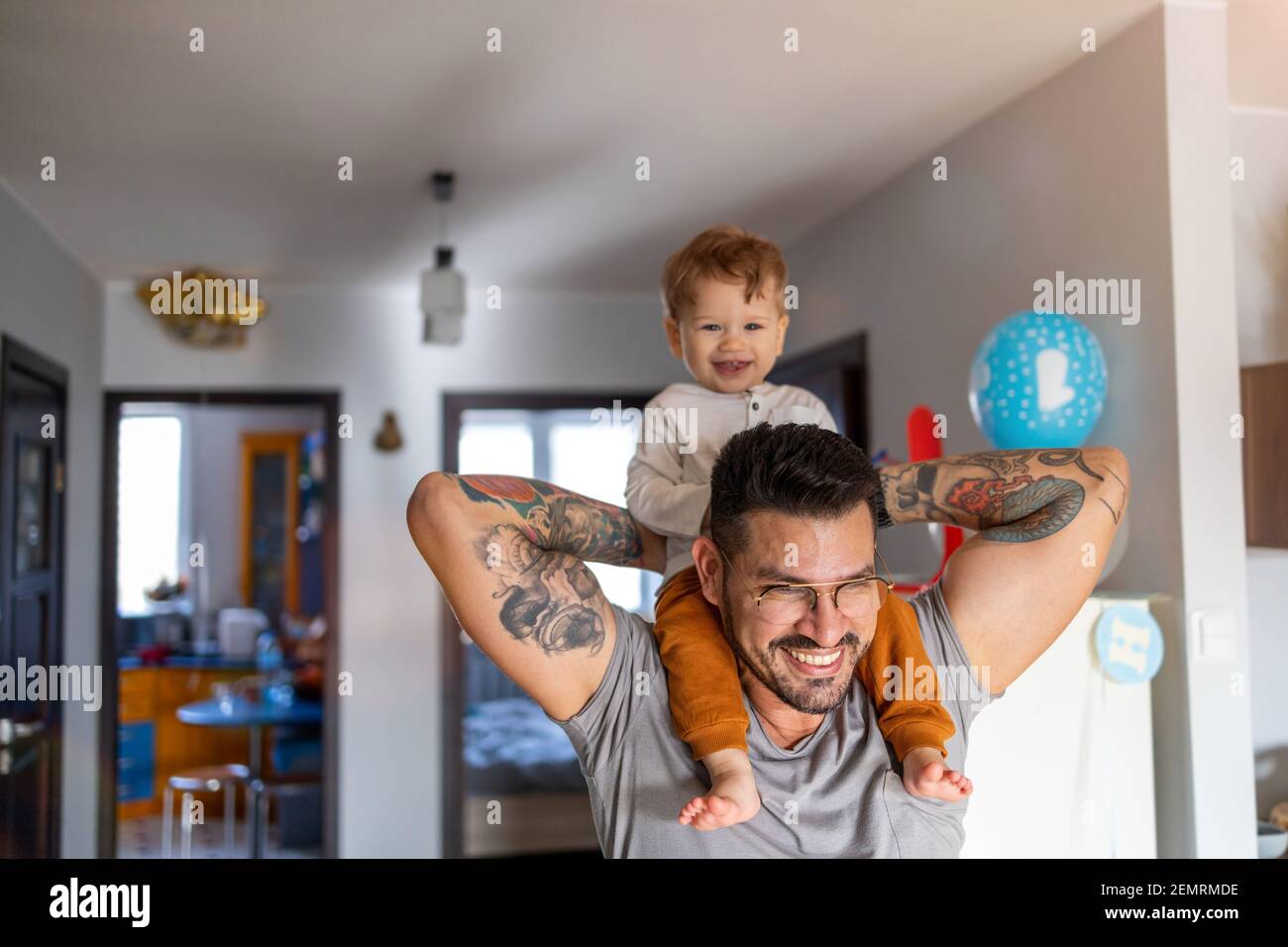 Father carrying son on shoulder hi-res stock photography and images - Alamy