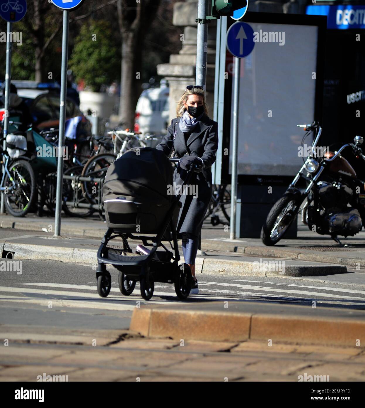 Milan, Agustina Gandolfo girlfriend of Lautaro Martinez in the center with the child Agustina Gandolfo, the Argentine girlfriend of LAUTARO MARTINEZ, INTER striker, surprised walking through the streets of the center with little NINA, born a few weeks ago. After having been to the hairdresser, Agustina Gandolfo also stops at a bar to breastfeed little NINA, before returning home. Stock Photo