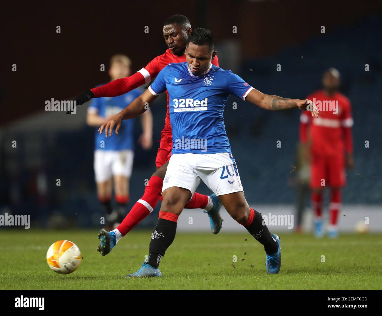 Royal Antwerp's Martin Hongla (left) and Rangers' Alfredo Morelos battle for the ball during the UEFA Europa League match at the Ibrox Stadium, Glasgo Stock Photo