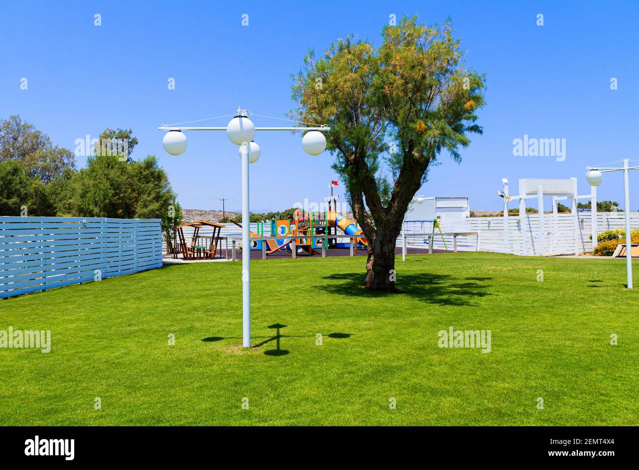 Children's wooden playground recreation area at public park Stock Photo