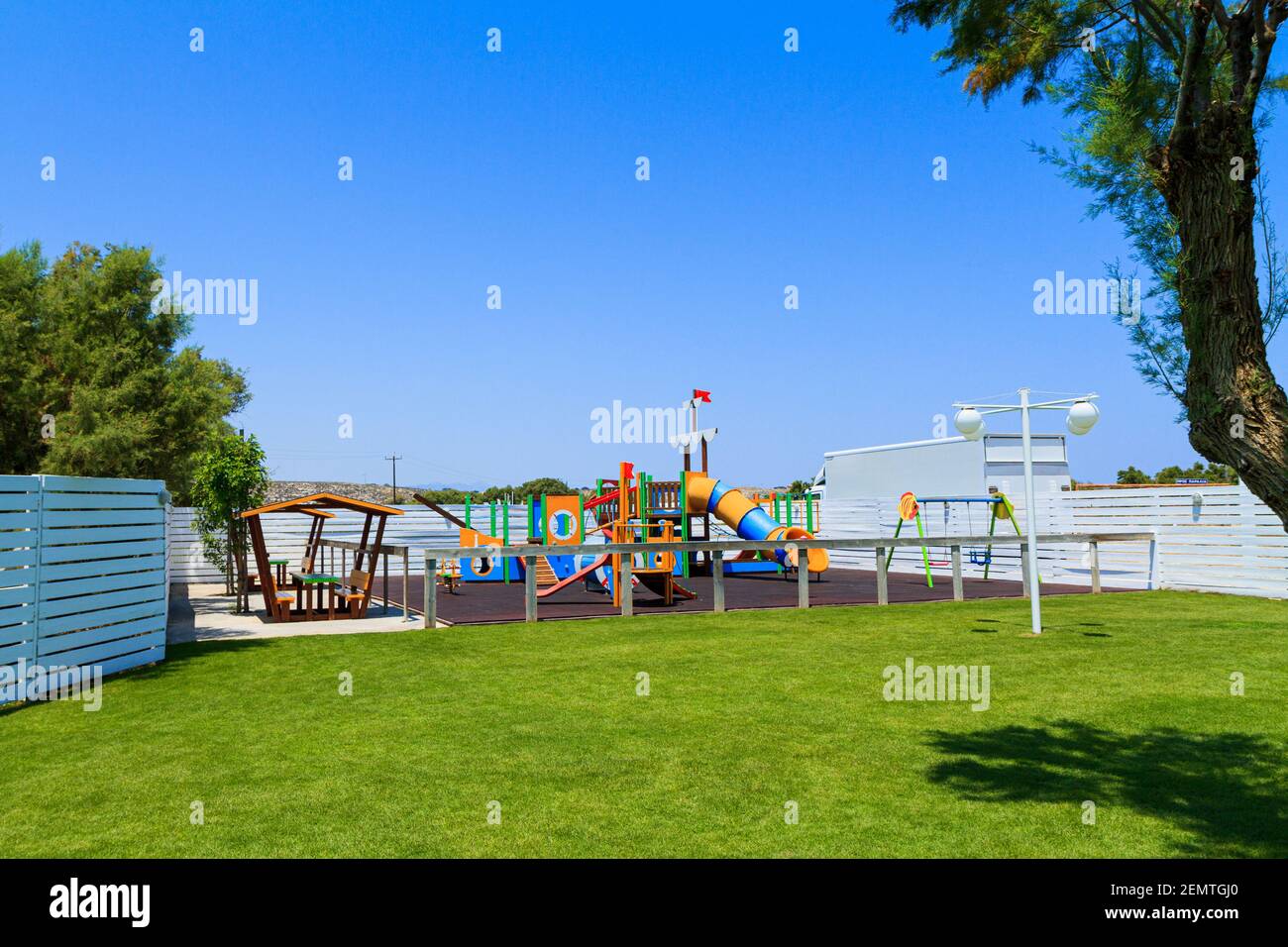 Children's wooden playground recreation area at public park Stock Photo