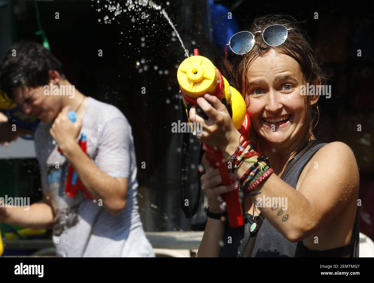 A tourist seen using a water gun during the festival. The Songkran