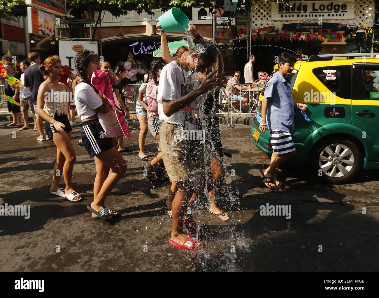 a-tourist-seen-pouring-water-at-a-thai-boy-during-the-festival-the