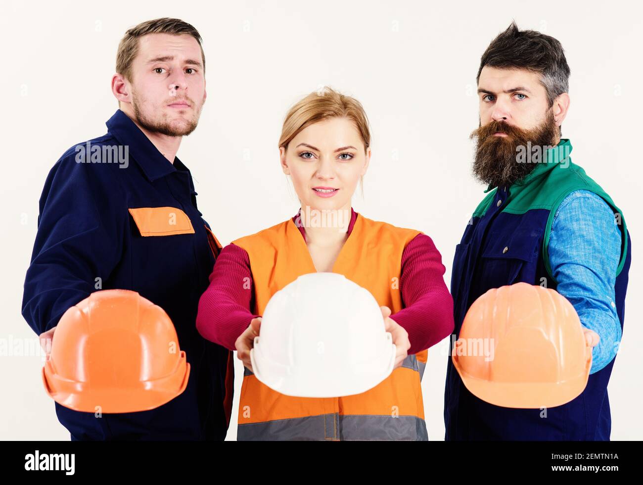 Safety and protection concept. Men and woman wears uniform and holds ...