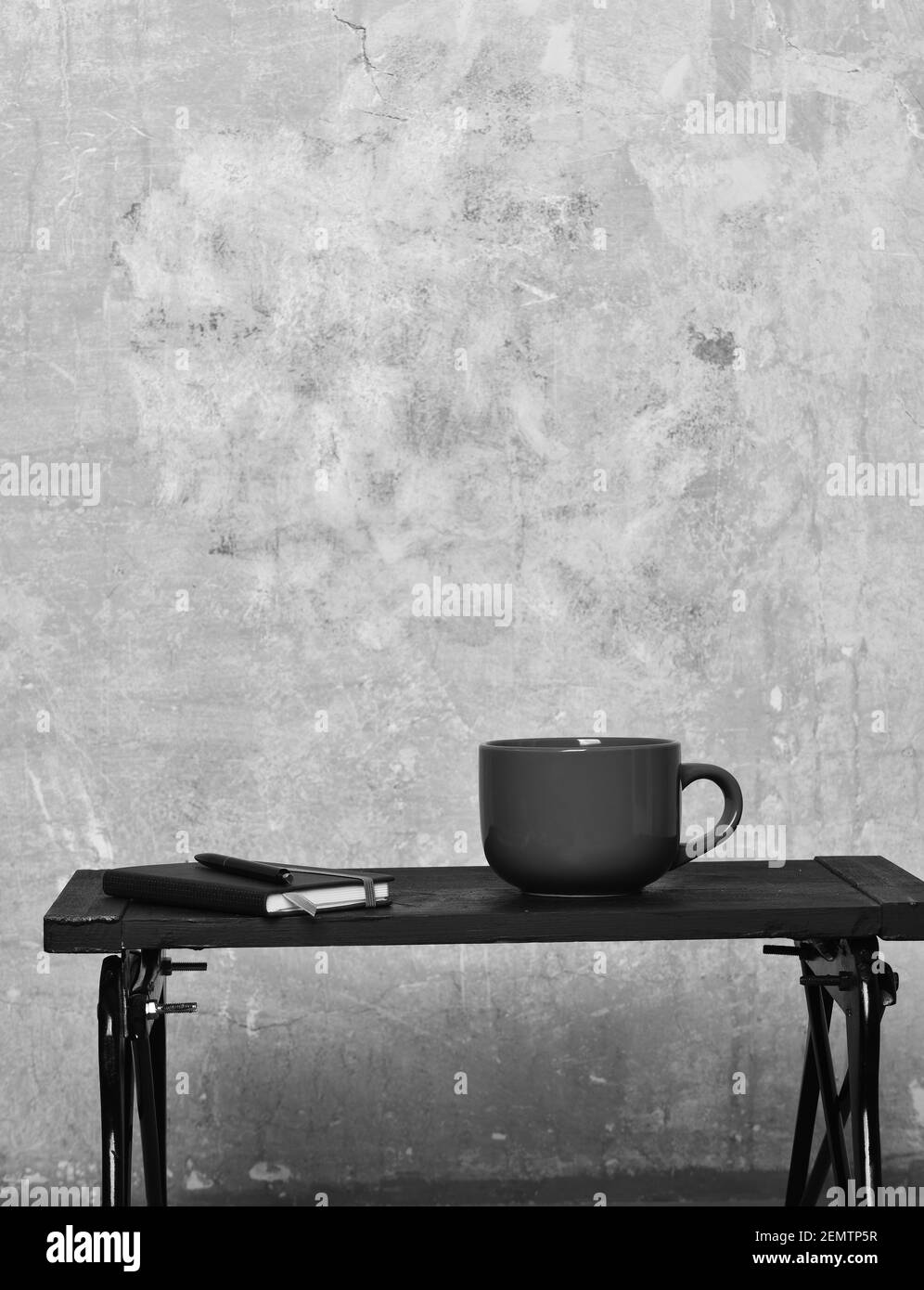 red tea or coffee cup or ceramic mug for drink copybook and pen black tray on beige textured background, copy space Stock Photo