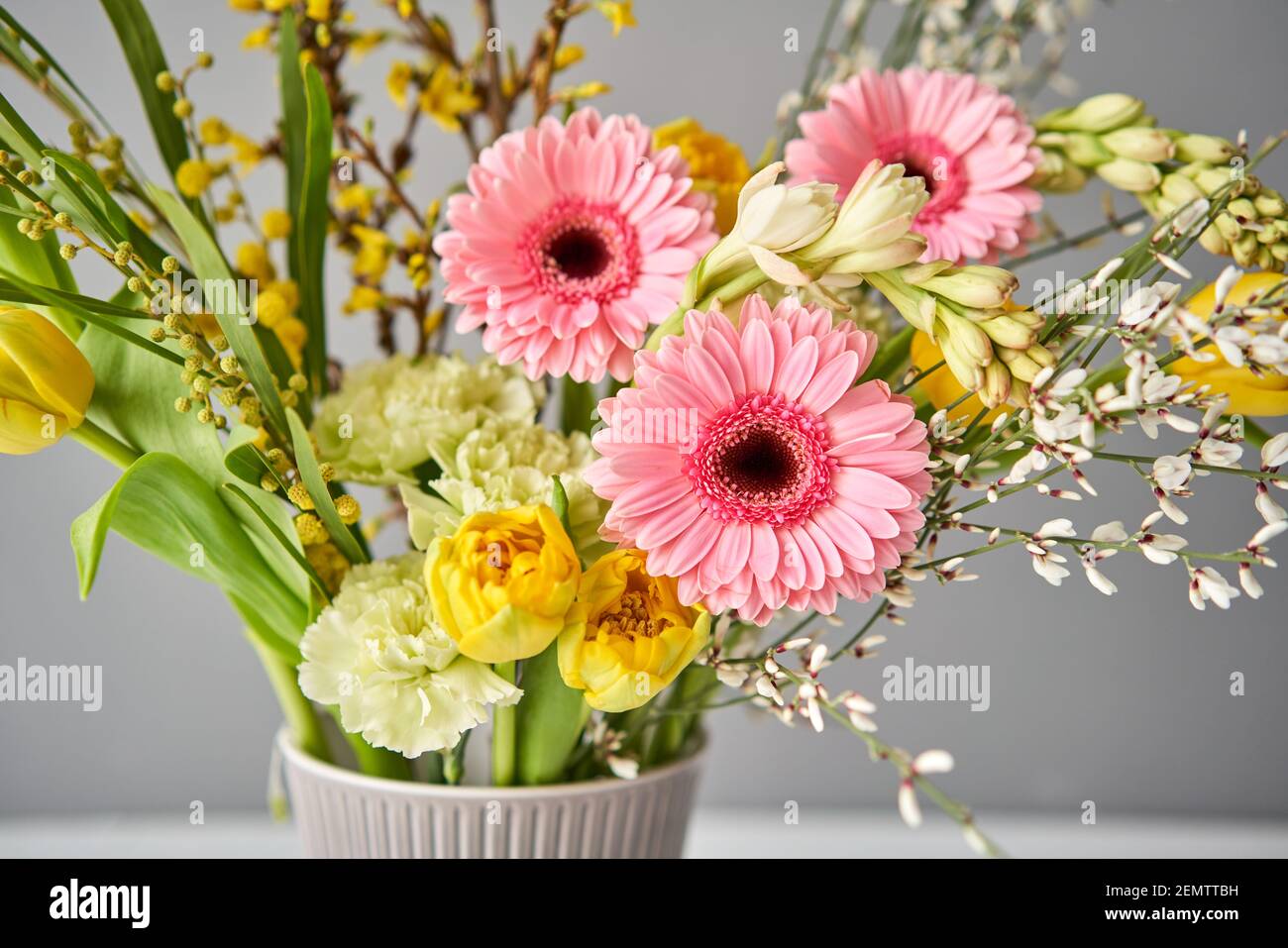 Finished flower arrangement in kenzan a vase for home. Flowers bunch, set for interior. Fresh cut flowers for decoration home. European floral shop Stock Photo