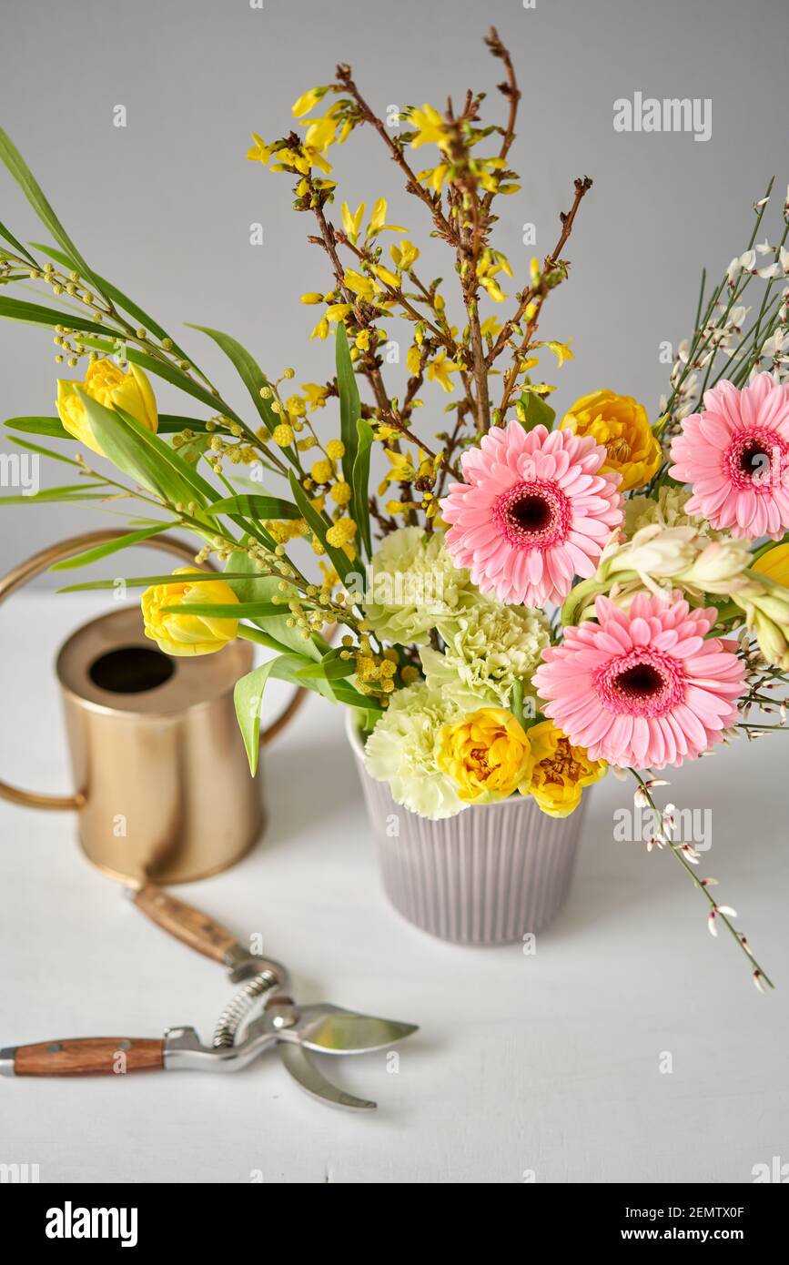 Finished flower arrangement in kenzan a vase for home. Flowers bunch, set for interior. Fresh cut flowers for decoration home. European floral shop Stock Photo